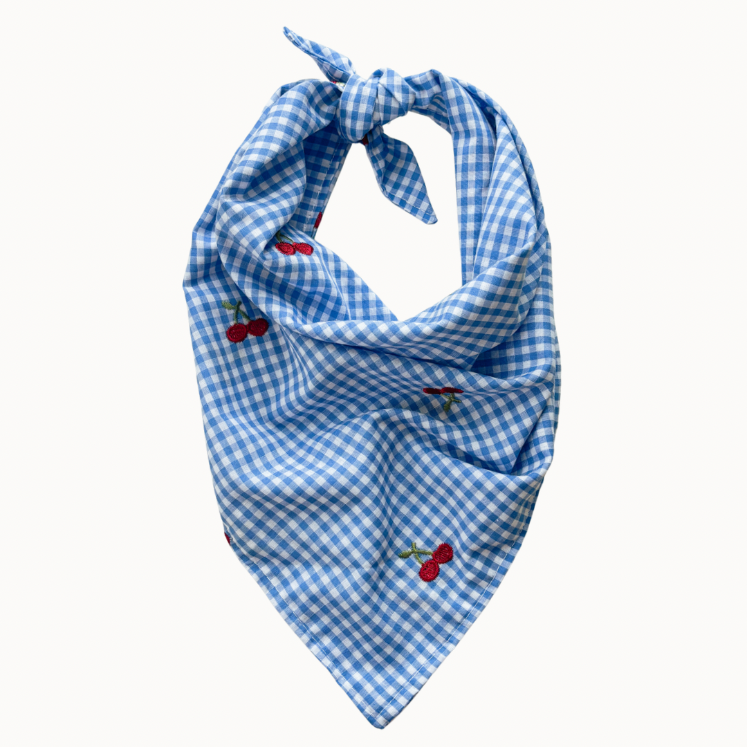 Blue gingham bandana with red cherries on a white background